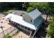 Aerial view of the community clubhouse with pool and parking area at 4711 Buttonbush Dr, Durham, NC 27712
