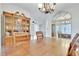Inviting dining room featuring a wooden table, a china cabinet, and an arched mirror at 4711 Buttonbush Dr, Durham, NC 27712