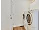 Bright laundry room featuring a full-size washer and dryer set at 4711 Buttonbush Dr, Durham, NC 27712