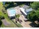 Aerial view of a community pool, clubhouse, and playground area at 4711 Buttonbush Dr, Durham, NC 27712
