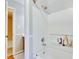 Shower/tub combination with white tile and built-in storage niche at 4711 Buttonbush Dr, Durham, NC 27712