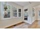 Charming sunroom with abundant windows offering serene views of the surrounding outdoor space and natural light at 4711 Buttonbush Dr, Durham, NC 27712