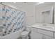 Bathroom featuring a shower with curtain, toilet, vanity, and a framed mirror at 484 Autumn Rain St, Cary, NC 27519