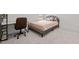 Comfortable bedroom with a bed, desk, office chair, and ample natural light at 484 Autumn Rain St, Cary, NC 27519
