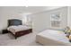 Bedroom featuring two beds, two windows, and neutral-colored walls for restful experience at 484 Autumn Rain St, Cary, NC 27519