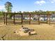 Community gathering spot with fire pit and wood pergola, a cozy spot to relax and enjoy company at 484 Autumn Rain St, Cary, NC 27519
