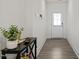 Welcoming entryway with hardwood flooring and decorative table at 484 Autumn Rain St, Cary, NC 27519