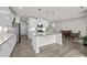 Modern kitchen with large island and dining area at 484 Autumn Rain St, Cary, NC 27519