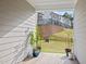 Relaxing patio featuring potted plants and a view of the backyard and townhouses at 484 Autumn Rain St, Cary, NC 27519