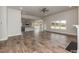 Spacious living room with hardwood floors, fireplace, and open access to kitchen and dining areas at 50 Watermelon Dr, Franklinton, NC 27525