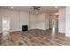 Spacious living room featuring hardwood floors, fireplace, and ample natural light at 50 Watermelon Dr, Franklinton, NC 27525