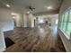 Open-concept living room featuring hardwood floors and a large kitchen at 50 Watermelon Dr, Franklinton, NC 27525