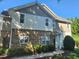 Charming townhouse featuring stone accents and well-maintained landscaping on a sunny day at 5033 Amber Clay Ln, Raleigh, NC 27612