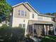Townhouse exterior showcasing siding, windows, and a screened porch overlooking a green landscape at 5033 Amber Clay Ln, Raleigh, NC 27612