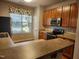 Well-equipped kitchen with a breakfast bar, stainless steel appliances, and wood cabinetry at 5033 Amber Clay Ln, Raleigh, NC 27612