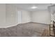 Spacious basement featuring wood-look floors, base trim, and fresh neutral paint at 505 Gooseneck Dr # A1, Cary, NC 27513