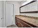 Bathroom features a granite countertop, dark wood vanity, and updated lighting at 505 Gooseneck Dr # A1, Cary, NC 27513