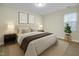 Bedroom with two bedside tables and a window for natural light at 505 Gooseneck Dr # A1, Cary, NC 27513