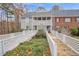 Charming townhome with a landscaped walkway leading to a covered porch at 505 Gooseneck Dr # A1, Cary, NC 27513