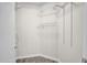 Walk-in closet features custom shelving, wood-look flooring, and neutral paint at 505 Gooseneck Dr # A1, Cary, NC 27513