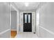 Welcoming foyer with tile flooring and a stylish front door, creating a great first impression at 515 Oakwood Ln, Graham, NC 27253