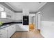 Efficient kitchen with white cabinets and updated appliances, designed for easy meal preparation at 515 Oakwood Ln, Graham, NC 27253