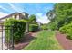 Well-maintained backyard features lush green lawn, shrubbery, and a privacy fence at 528 Bankhead Dr, Cary, NC 27519