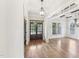 Inviting foyer featuring hardwood floors, paneled walls, and striking lighting at 528 Bankhead Dr, Cary, NC 27519