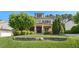 Inviting two-story home featuring a stone retaining wall and lush, green landscaping at 528 Bankhead Dr, Cary, NC 27519