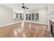 Inviting living room with a fireplace, hardwood floors and bar top overlooking kitchen at 528 Bankhead Dr, Cary, NC 27519