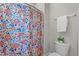 Bathroom featuring a floral shower curtain, and a white towel and toilet at 5420 Royal Troon Dr, Raleigh, NC 27604