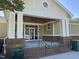 Entrance to the community athletic club features brick steps, planters, and a covered entryway at 5420 Royal Troon Dr, Raleigh, NC 27604