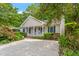Charming single-story home featuring a well-manicured front yard and cozy front porch area at 5420 Royal Troon Dr, Raleigh, NC 27604