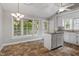 Charming kitchen featuring granite countertops, an island and natural light at 5420 Royal Troon Dr, Raleigh, NC 27604