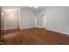 Bright living room showcasing laminate flooring, vaulted ceilings, and natural lighting throughout at 5420 Royal Troon Dr, Raleigh, NC 27604