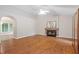 Spacious living room with vaulted ceiling, fireplace, and laminate flooring throughout at 5420 Royal Troon Dr, Raleigh, NC 27604