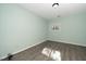 Cozy bedroom with neutral walls and laminate flooring, bathed in natural light at 6011 Winterpointe Ln # 205, Raleigh, NC 27606