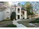 Attractive condo building with a landscaped walkway and inviting staircase entrance at 6011 Winterpointe Ln # 205, Raleigh, NC 27606