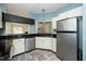 Spacious kitchen offers stainless steel appliances, ample cabinets and a view of the backyard at 6011 Winterpointe Ln # 205, Raleigh, NC 27606