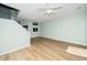 Spacious living room featuring neutral paint, ceiling fan and hardwood floors at 6011 Winterpointe Ln # 205, Raleigh, NC 27606