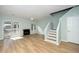 Inviting living room features sleek floors, a fireplace, and sliding glass doors to a private balcony at 6011 Winterpointe Ln # 205, Raleigh, NC 27606