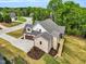 Aerial view of a well-manicured home showcasing a backyard and mature landscaping, emphasizing its curb appeal and outdoor space at 669 Balmoral St, Clayton, NC 27520