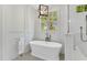 Bright bathroom with soaking tub, glass shower, and natural light at 669 Balmoral St, Clayton, NC 27520