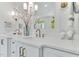Elegant bathroom with dual sinks, marble countertops, and decorative light fixtures at 669 Balmoral St, Clayton, NC 27520
