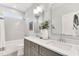 Bright bathroom featuring double vanity, tiled shower, and neutral color palette, offering a serene and modern design at 669 Balmoral St, Clayton, NC 27520