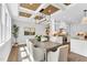 Open-concept dining area with a wooden table, views to the kitchen, and a unique ceiling at 669 Balmoral St, Clayton, NC 27520