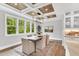 Bright dining room with large windows, hardwood floors, and a modern ceiling design at 669 Balmoral St, Clayton, NC 27520