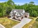 Stunning two-story brick home with a two-car garage and meticulously landscaped front yard and circular driveway at 669 Balmoral St, Clayton, NC 27520