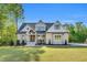 Beautiful two-story home boasts a brick facade, gabled roof, and a well-manicured lawn at 669 Balmoral St, Clayton, NC 27520