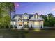 Stunning two-story home boasts a brick facade, gabled roof, and a well-manicured lawn at 669 Balmoral St, Clayton, NC 27520